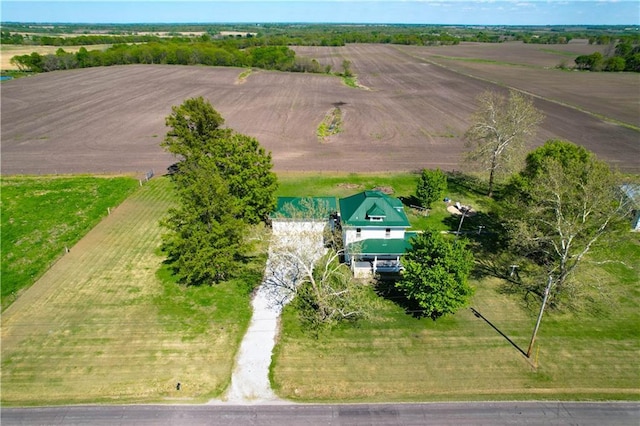 birds eye view of property with a rural view