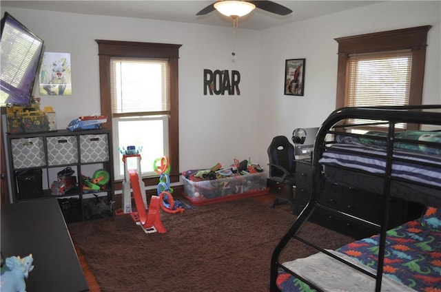 bedroom with multiple windows and a ceiling fan