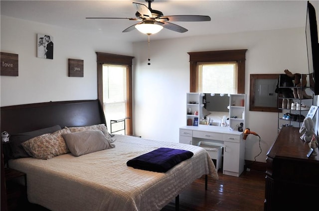 bedroom featuring a ceiling fan and dark wood-style floors