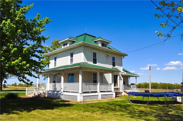view of front of house with a porch and a front yard