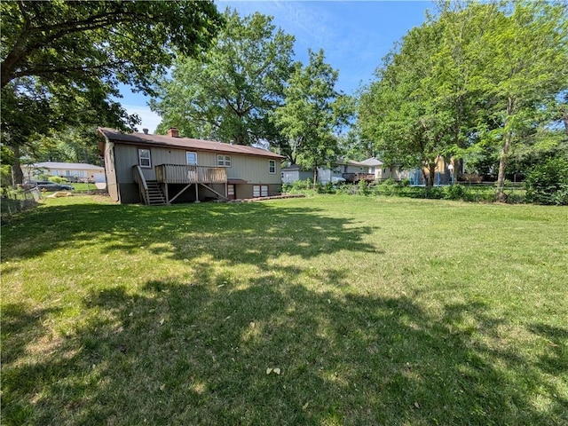 view of yard with stairway and a wooden deck