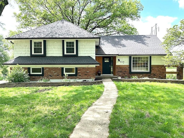 9314 Roe Ave, Prairie Village, KS 66207 - tri-level home featuring a shingled roof, brick siding, and a front yard