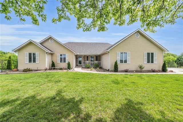 single story home with covered porch and a front yard