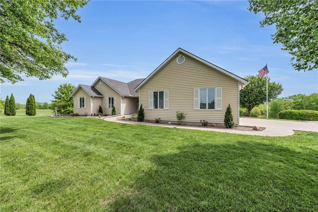single story home featuring a front yard