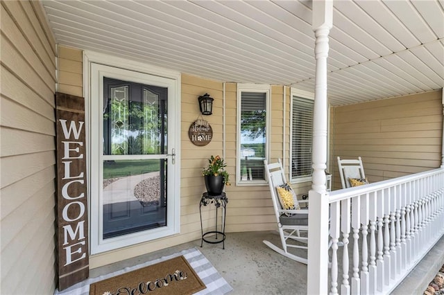 property entrance with covered porch