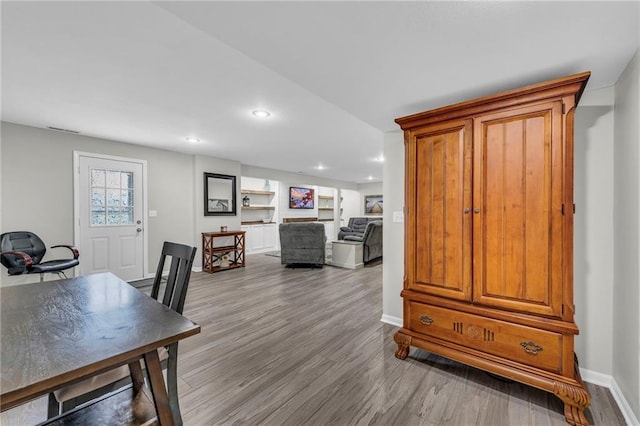 office with wood finished floors, baseboards, and recessed lighting