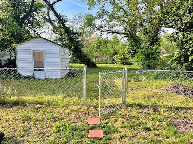 view of yard featuring a storage shed, an outdoor structure, and fence