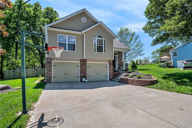 view of front of home featuring a garage, fence, a front lawn, concrete driveway, and brick siding