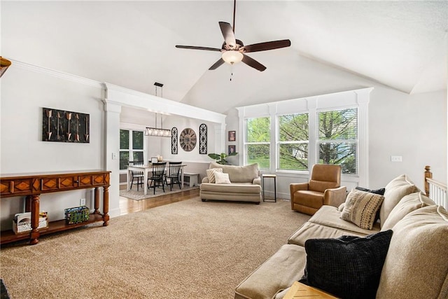 living room featuring carpet flooring, baseboards, ceiling fan, and high vaulted ceiling
