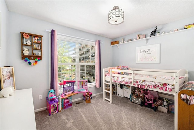 carpeted bedroom featuring baseboards