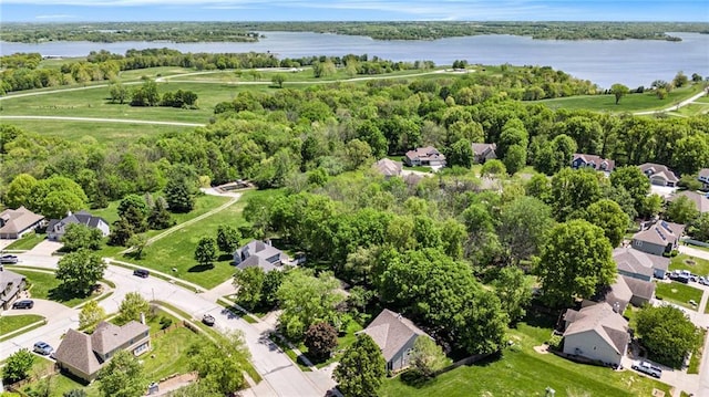 drone / aerial view with a water view and a residential view