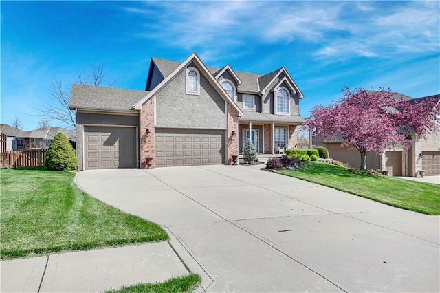 8904 NE 94th Pl, Kansas City, MO 64157 - view of front of house with a garage, driveway, brick siding, roof with shingles, and covered porch