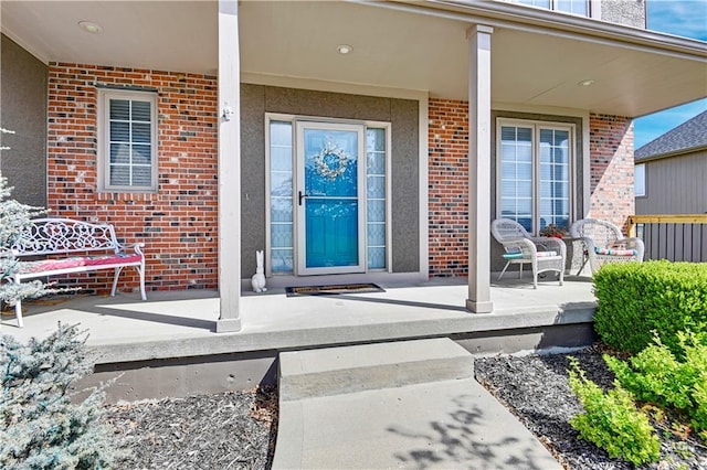 8904 NE 94th Pl, Kansas City, MO 64157 - property entrance with covered porch and brick siding