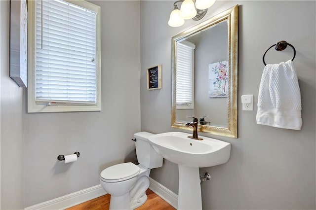 8904 NE 94th Pl, Kansas City, MO 64157 - half bathroom with baseboards, toilet, and wood finished floors