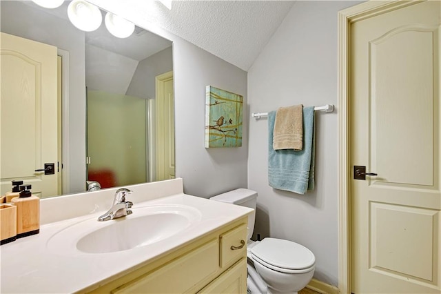 8904 NE 94th Pl, Kansas City, MO 64157 - bathroom with lofted ceiling, toilet, vanity, and a textured ceiling
