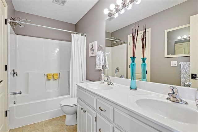 8904 NE 94th Pl, Kansas City, MO 64157 - full bath featuring toilet, shower / bath combo, double vanity, tile patterned flooring, and a textured ceiling