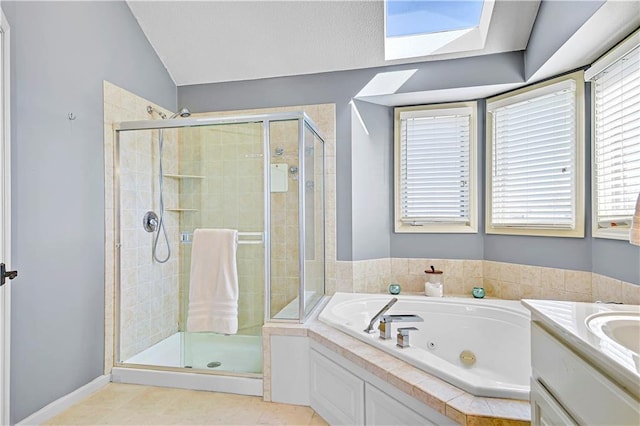 8904 NE 94th Pl, Kansas City, MO 64157 - full bath featuring a tub with jets, a shower stall, vaulted ceiling, a skylight, and vanity