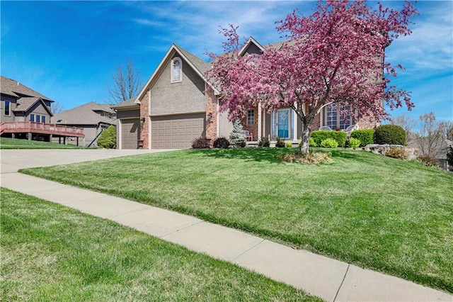 8904 NE 94th Pl, Kansas City, MO 64157 - obstructed view of property with a front lawn, an attached garage, concrete driveway, and brick siding