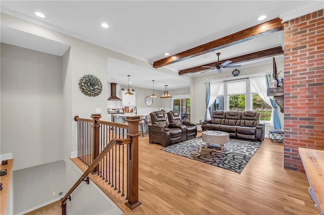 living room with a ceiling fan, light wood-style floors, beamed ceiling, and recessed lighting