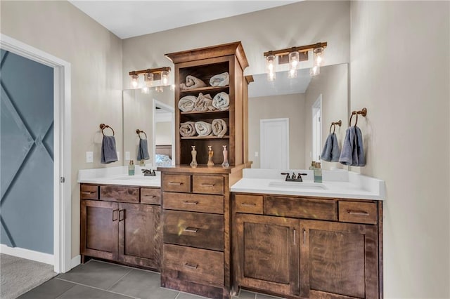 full bathroom featuring two vanities and tile patterned flooring
