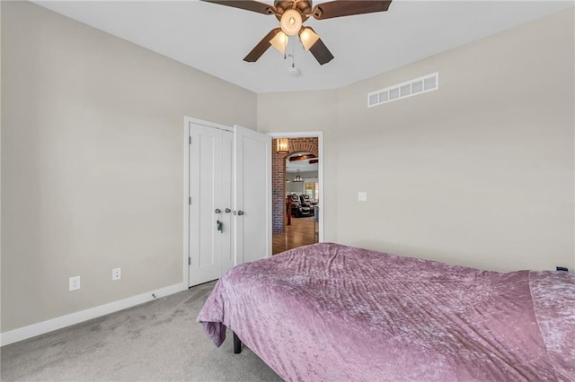 carpeted bedroom featuring baseboards, ceiling fan, and a closet
