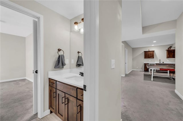 bathroom with baseboards and vanity