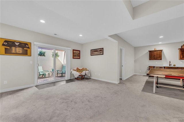 recreation room with light carpet, recessed lighting, and baseboards