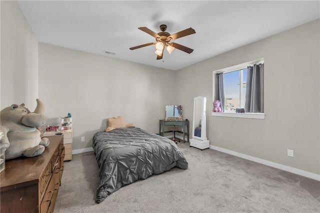 carpeted bedroom with baseboards and ceiling fan