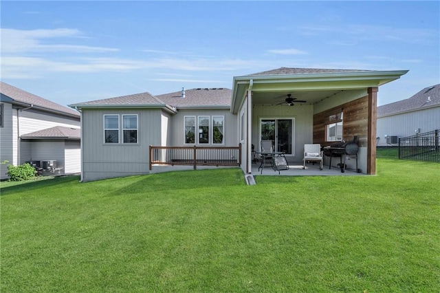 back of property featuring a ceiling fan and a patio