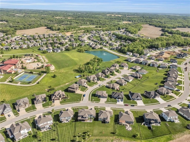 view of property location with a large body of water and nearby suburban area