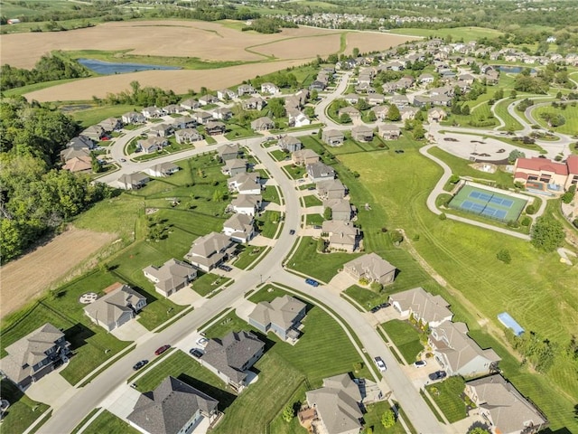 view of property location with nearby suburban area and a large body of water