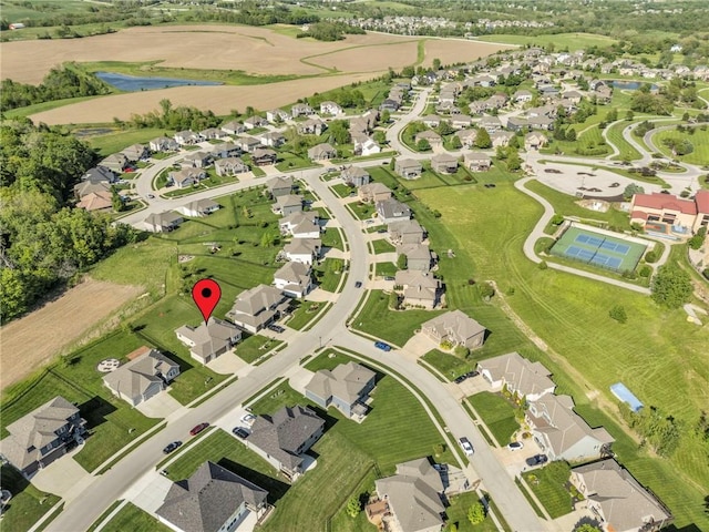 aerial overview of property's location with nearby suburban area and a large body of water