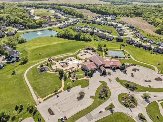 view of property location featuring a large body of water and nearby suburban area