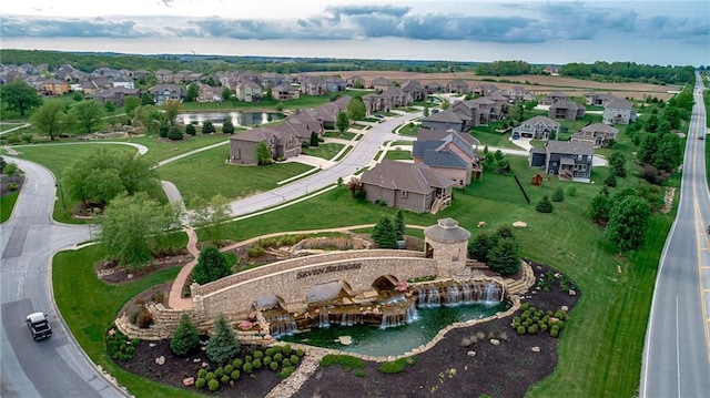 aerial view of property and surrounding area featuring nearby suburban area