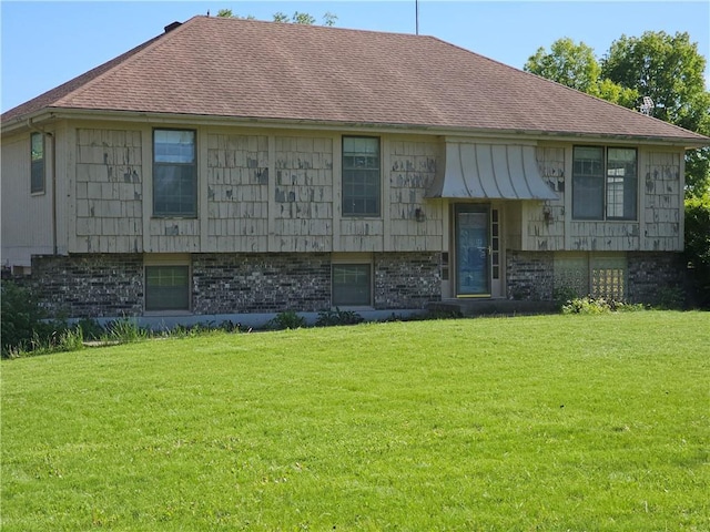 4307 211th St, Belton, MO 64012 - split foyer home with a front yard, brick siding, and roof with shingles