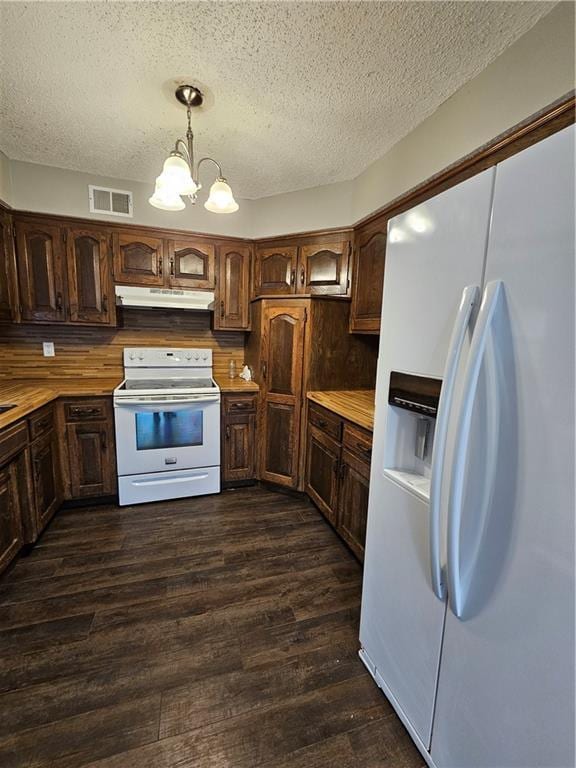 4307 211th St, Belton, MO 64012 - kitchen with white appliances, dark wood-style flooring, a textured ceiling, under cabinet range hood, and pendant lighting