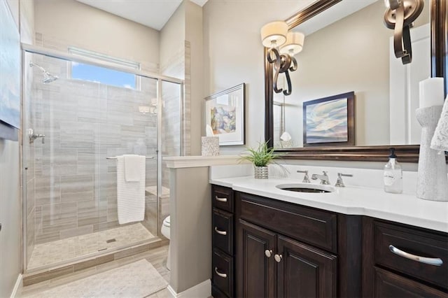 17005 Bradshaw St, Overland Park, KS 66221 - bathroom featuring vanity, a stall shower, and toilet