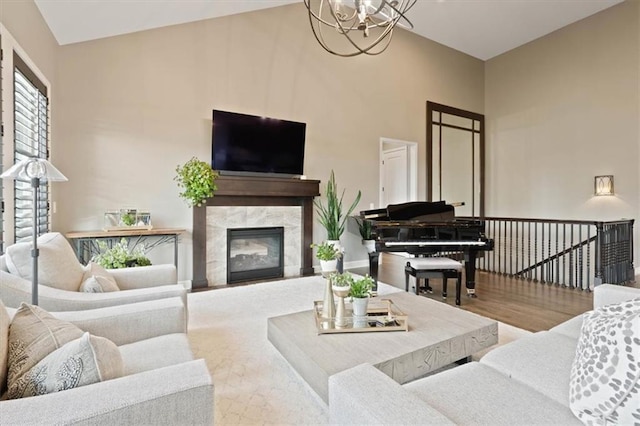 17005 Bradshaw St, Overland Park, KS 66221 - living area featuring a fireplace, a chandelier, wood finished floors, and a towering ceiling