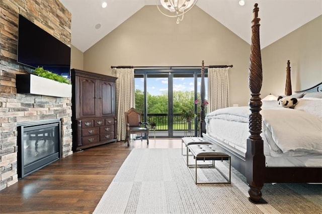 17005 Bradshaw St, Overland Park, KS 66221 - bedroom with high vaulted ceiling, access to exterior, dark wood finished floors, a fireplace, and recessed lighting