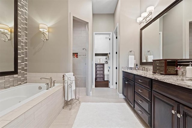 17005 Bradshaw St, Overland Park, KS 66221 - bathroom with double vanity, a garden tub, and tile patterned flooring
