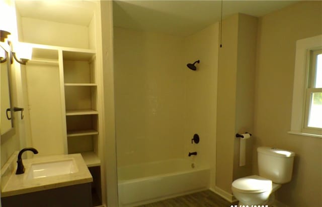full bathroom featuring vanity,  shower combination, toilet, and wood finished floors