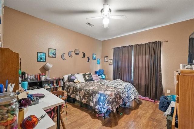 425 Thornton St, Leavenworth, KS 66048 - bedroom featuring wood finished floors and a ceiling fan