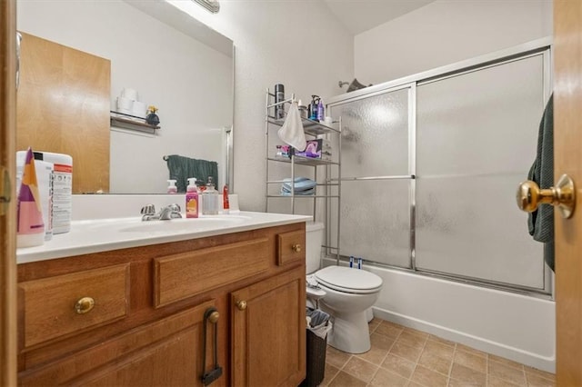 425 Thornton St, Leavenworth, KS 66048 - bathroom featuring vanity, toilet, and combined bath / shower with glass door