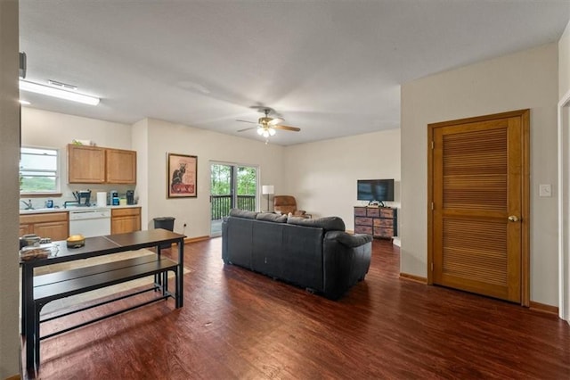 425 Thornton St, Leavenworth, KS 66048 - living room featuring dark wood-style flooring, a ceiling fan, and baseboards