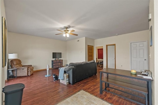 425 Thornton St, Leavenworth, KS 66048 - living area featuring a ceiling fan, wood finished floors, and baseboards