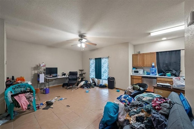 425 Thornton St, Leavenworth, KS 66048 - miscellaneous room featuring an office area, ceiling fan, tile patterned flooring, and a textured ceiling