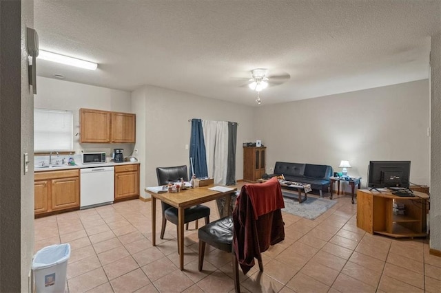 425 Thornton St, Leavenworth, KS 66048 - dining area featuring light tile patterned floors, a ceiling fan, a desk, and a textured ceiling