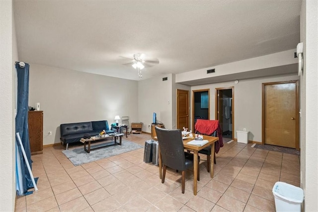 425 Thornton St, Leavenworth, KS 66048 - dining area featuring a ceiling fan, light tile patterned flooring, and baseboards