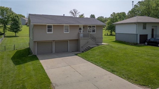 211 Carla St, Excelsior Springs, MO 64024 - view of front of house featuring a garage and driveway