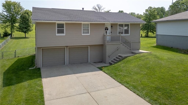 211 Carla St, Excelsior Springs, MO 64024 - view of front facade with an attached garage, driveway, and roof with shingles